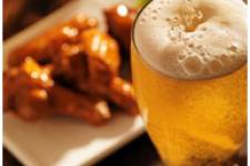 Glass of beer with chicken wings