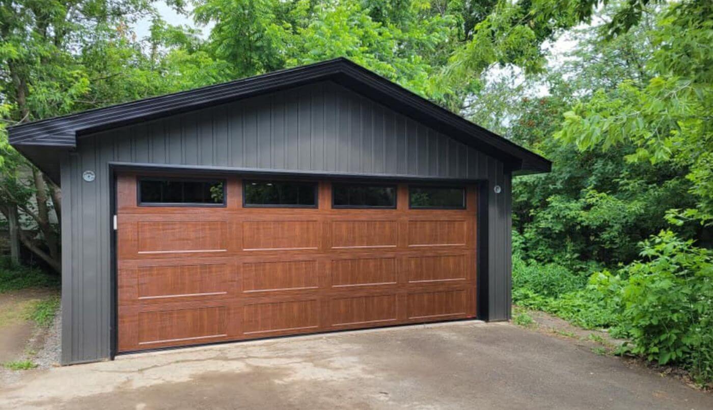 A garage featuring a Chocolate Walnut door blending seamlessly with its surroundings.
